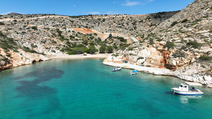 Aerial drone photo of beautiful secluded fjord shaped cove of Tourkopigado, Irakleia island, small...
