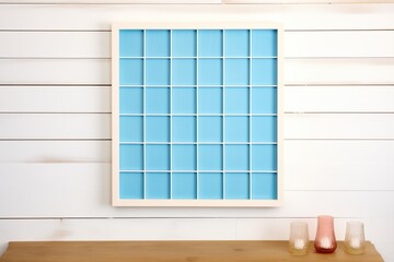 shot of blue square grid on a light wooden surface