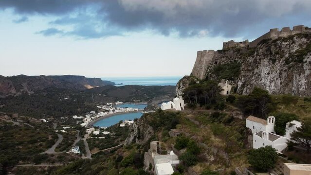 Flyby next to Chora Castle Walls Revealing Kapsali Bay, Kythira Island, Greece