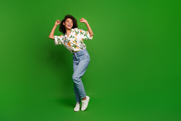 Photo of positive cheerful energetic lady raise hands up dancing isolated over vivid color background