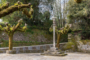 Fototapeta na wymiar A Ponte Ulla, Spain. Traditional cruceiro or cross in the Way of Saint James, a popular pilgrimage route in Europe