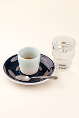 The espresso coffee on colored background