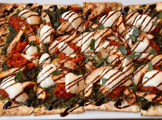 Chicken Margherita pizza with balsamic drizzle