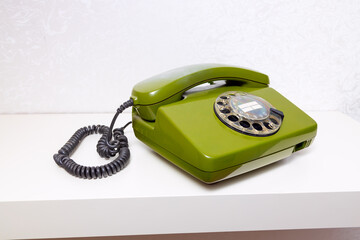 Old vintage telephones on a shelves