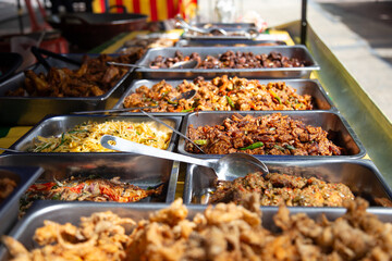 Different dishes at street food stall in Kuala Lumpur - obrazy, fototapety, plakaty