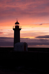 lighthouse at sunset in Porto