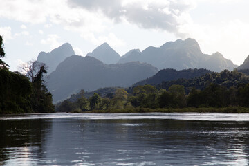 Nam Ou river with mountain range in background, Northern Laos