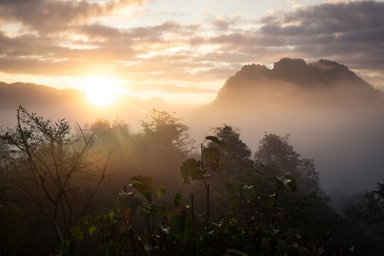 Foggy sunrise in the exotic mountains of Northern Laos