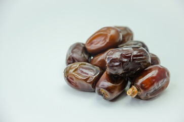 Dried dates on a white background