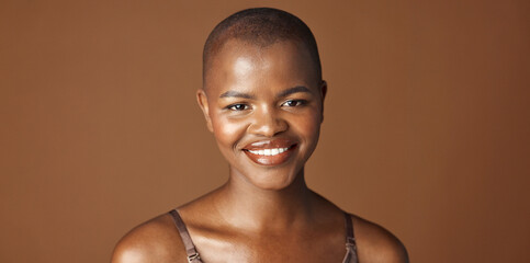 Face, beauty and smile with happy black woman in studio isolated on brown background for wellness....