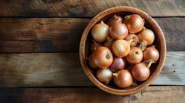 Onions in a wooden bowl on a table