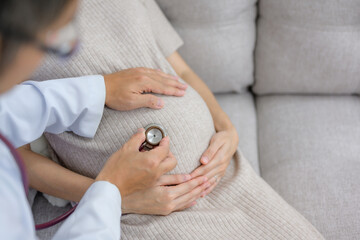 Obstetrician doctor doing health checkup for pregnant woman with large pregnancy and gynecology consultation Examine the stomach Health of pregnant women and prenatal care - obrazy, fototapety, plakaty