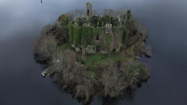 McDermott Castle on an island in Lough Key, County Roscommon, Ireland, at dusk, tranquil and historic, aerial shot