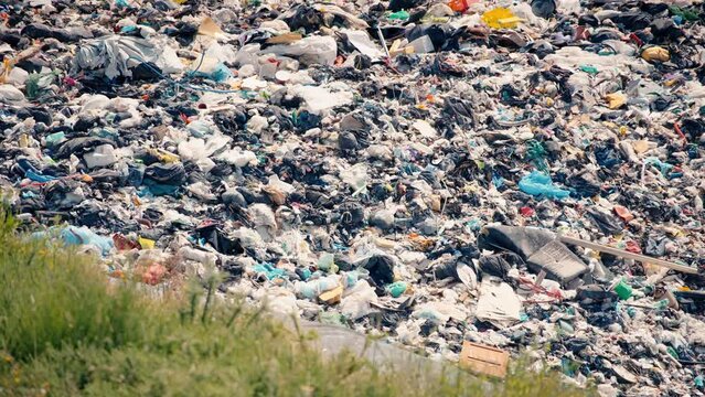 Close-up of waste in an open dump
