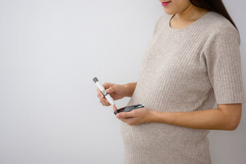 Pregnant women check their blood sugar levels before giving birth to check for diabetes before...