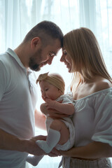 adorable parents with their little baby