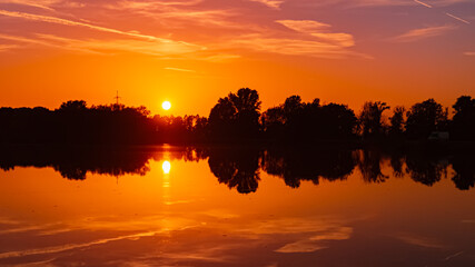Sunset with reflections near Plattling, Isar, Deggendorf, Bavaria, Germany