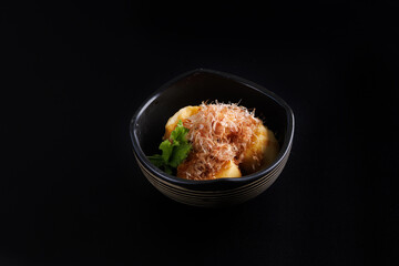 Japanese tofu Japanese appetizer soft cold tofu with sauce ginger and green onion topping isolated in black background