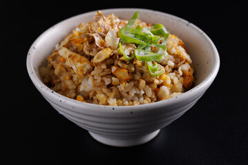 Japanese fried rice yakimeshi isolated in black background
