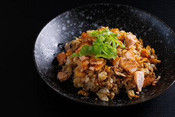 Japanese fried rice yakimeshi isolated in black background