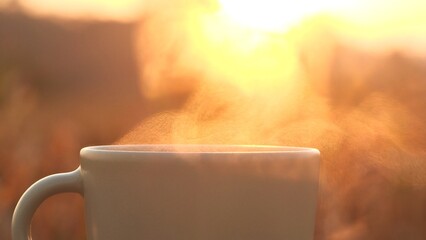 Close up coffee cup. Stunning steam rising from steaming mug of coffee set atop table against 4K...