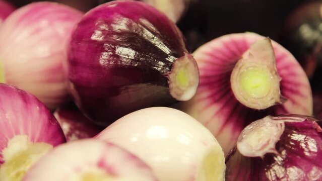 Following Cloes Up Shot of Washed, Peeled Red Onions