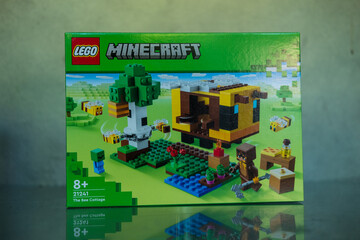 Fototapeta premium Bangkok, Thailand - January 24, 2024 : A box of LEGO Minecraft The Bee Cottage number of 21241. Action-packed set featuring Minecraft iconic bees. Lego is a popular line of construction