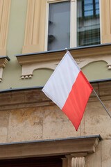 Fototapeta premium Flag of Poland on a facade of building