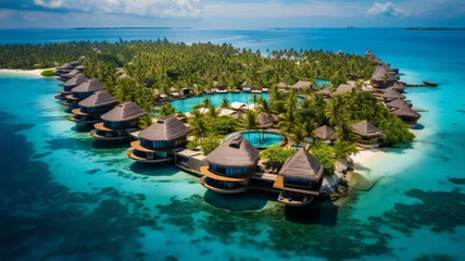 Poster Pool in the tropical island. Aerial view of luxury resort bungalows along the coastline of a small island, Indian Ocean, Maldives  © Oleksandra