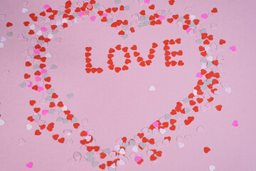 Valentine's day background, pink color, paper hearts. Congratulations on February 14th.