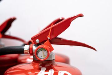 A fire extinguisher in the production room. Fire extinguishing system. A hand-held fire extinguisher in case of fire.