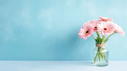 Gordijnen Pink gerbera flowers in vase on blue background © Inlovehem