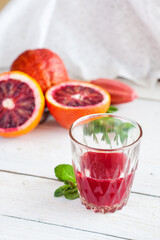Close-up of Blood Orange Juice and Fresh Halves - 718118553