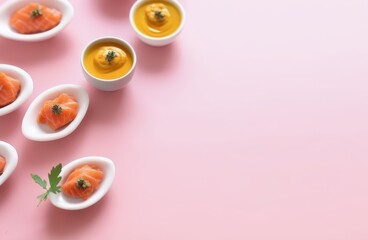 Obraz na płótnie Canvas Salmon and mango puree on a pink background, creative food presentation