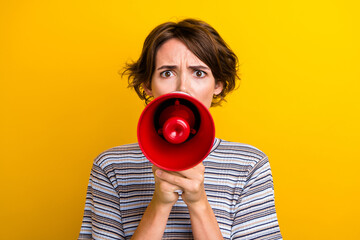 Photo of disappointed angry girl hand hold bullhorn shout scream loud sound voice isolated on...