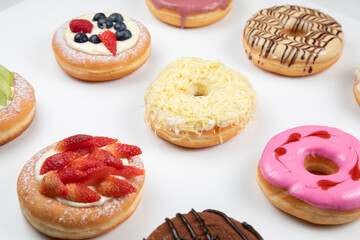 Obraz na płótnie Canvas fruity and delicious doughnut isolated on white background