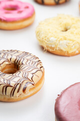 Obraz na płótnie Canvas fruity and delicious doughnut isolated on white background