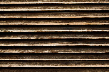 Grunge wood stripes. Raw brown wooden wall background. Rustic tree desk with knots pattern. Countryside architecture wall. Village building construction. Brown wood texture. Wooden lines pattern.