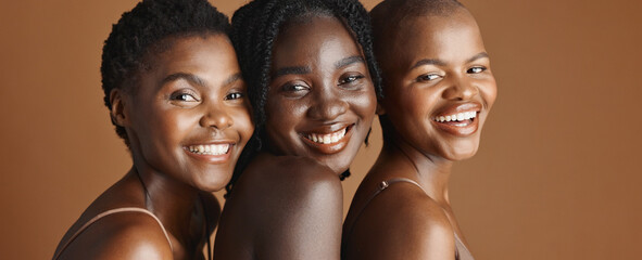 Face, beauty and laughing with black woman friends in studio on a brown background for natural...