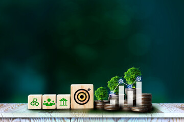 ESG icon concept in cube blocks and coin, graph, tree, for environmental, social, and governance in...