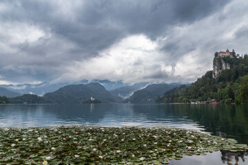 Lake Bled Slovenia. Beautiful mountain lake with small Pilgrimage Church. Most famous Slovenian lake and island Bled with Pilgrimage Church of the Assumption of Maria and Bled Castle in background.