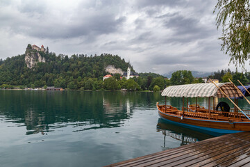 Lake Bled Slovenia. Beautiful mountain lake with small Pilgrimage Church. Most famous Slovenian lake and island Bled with Pilgrimage Church of the Assumption of Maria and Bled Castle in background.