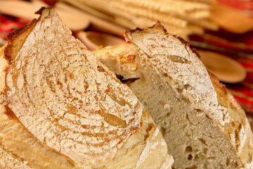 Close up with the crust of a fresh home made bread out the oven. Tasty bread bakery photographed in ambiental light. Food photography details. Selective focus.