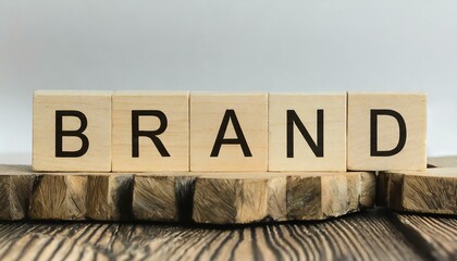 the term "Brand," spelled out using wooden cube letter blocks on a pure white background. 