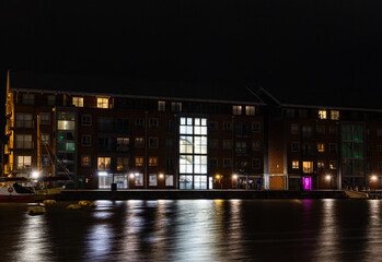 Illuminated Quayside Apartments Across The Quay At The Historic Docks At Gloucester At Night In...