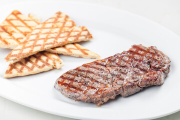 beef steak with grilled pita bread