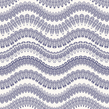 Vector waves seamless pattern with stylized bird feathers. Blue tribal ornaments on a white background
