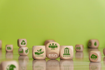 ESG concept regarding environment, social, and governance. Green esg icon symbol on wooden block....