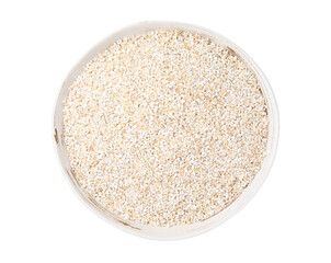 Dry barley groats in bowl isolated on white, top view