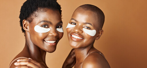 Beauty, eye pads and face of black women in studio with glowing, natural and facial routine. Smile,...